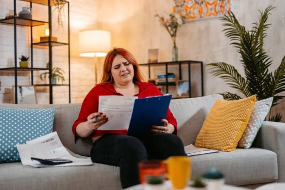Woman reviewing health report at home