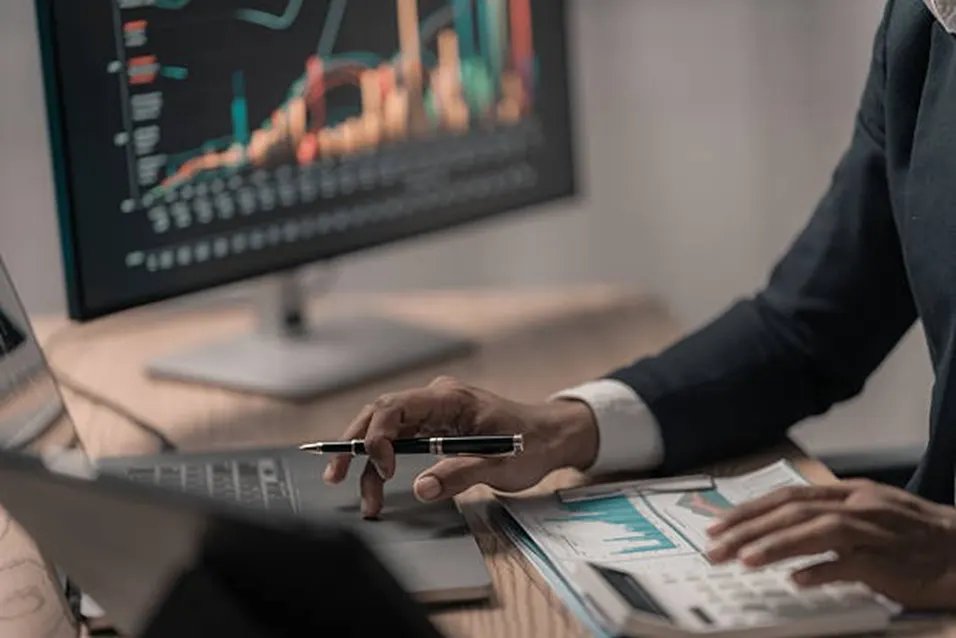 Analyst reviewing investment charts