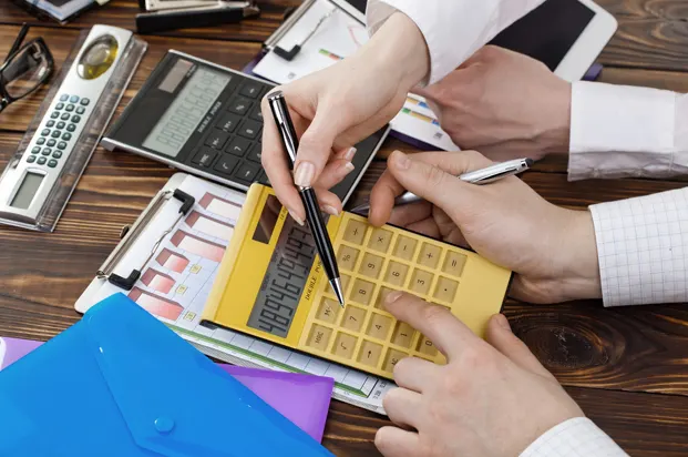 Financial advisors reviewing loan calculations