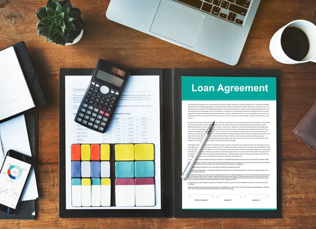 Loan agreement documents on desk