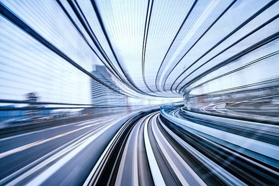 High-speed motion blur through a futuristic tunnel representing pace