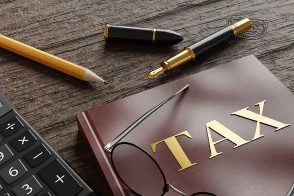 Tax book with calculator